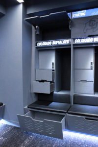 Colorado Buffaloes Basketball lockers with open view showing overhead storage and drawer components and without jerseys displayed
